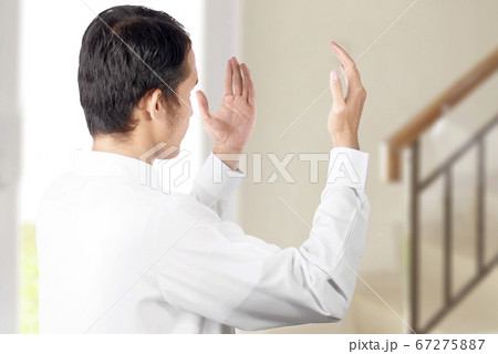 Asian Muslim man standing while raised hands and Asian Muslim man standing while raised hands and 67275887