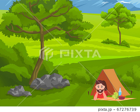 Young guy relaxing lying under tent with picnic food at blanket, happy tourist enjoy nature 67276739