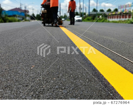 Yellow traffic line in Thailand 67276964