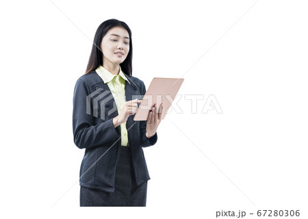 Asian businesswoman standing while using tablet 67280306