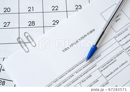 Typical Visa application form and blue pen on 67283571