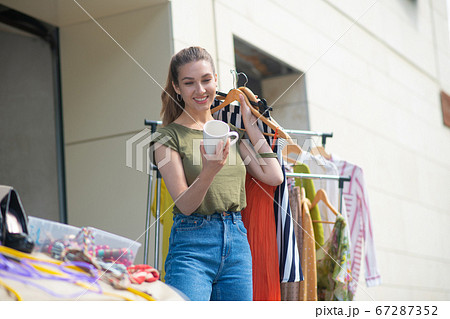 Nice pretty woman looking at the cup Nice pretty woman looking at the cup 67287352