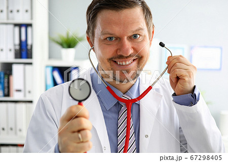 Handsome male doctor put on stethoscope portrait Handsome male doctor put on stethoscope portrait 67298405