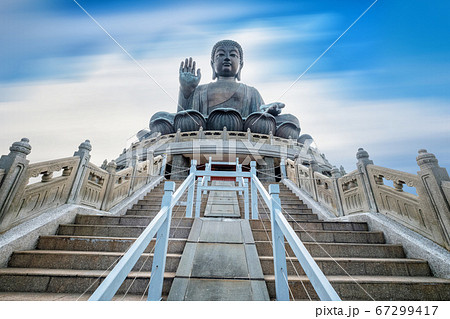 Tian Tan Giant Buddha on Blue sky background 67299417