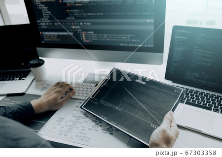 Asian man working code program developer computer 67303358