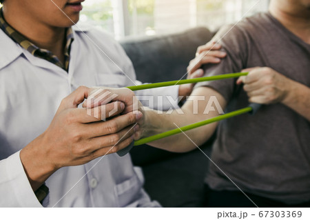 Close up hand patient doing stretching exercise 67303369