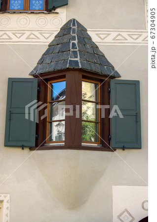 Old Small balcony with wooden windows - Engadine Valley Switzerland Old Small balcony with wooden windows - Engadine Valley Switzerland 67304905