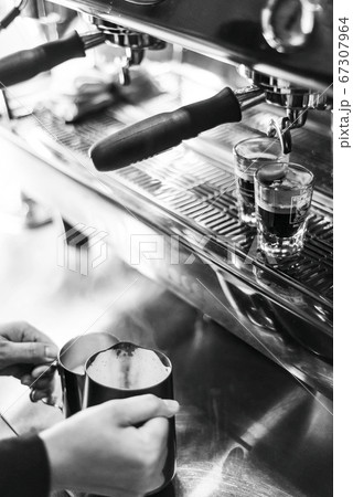 making espresso coffee close up detail with modern 67307964