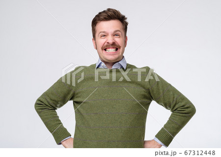 man with a happy surprised expression with broad smile man with a happy surprised expression with broad smile 67312448