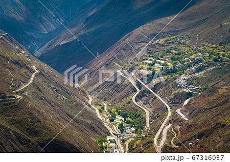 Beautiful mountain landscape view and winding road of Shangri-la country, Yunnan province, China 67316037