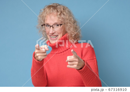 senior woman pointing you, saying you are great. 67316910
