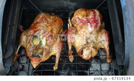 Barbecue duck grilling, cooking food. Barbecue duck grilling, cooking food. 67319134