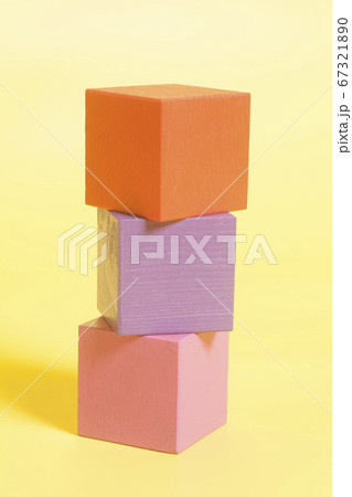 Multiple colored cubes on yellow background Multiple colored cubes on yellow background 67321890