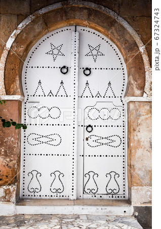 Tunis, TUNISIA - February 06, 2009: Traditional doors in Tunisia's old and beautiful colors. 67324743