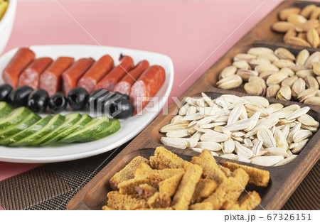 Cucumber sausage salad with crackers and dry fruits Cucumber sausage salad with crackers and dry fruits 67326151