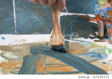 Abstract painting with a wooden brush 67326155