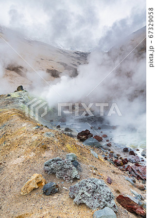 Mountain landscape, crater of active volcano: fumarole, hot spring, lava field, gas-steam activity. Dramatic volcanic landscape, travel destinations 67329058