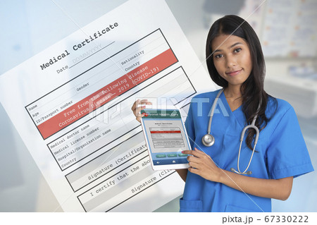 Female doctor holding digital tablet that show Female doctor holding digital tablet that show 67330222