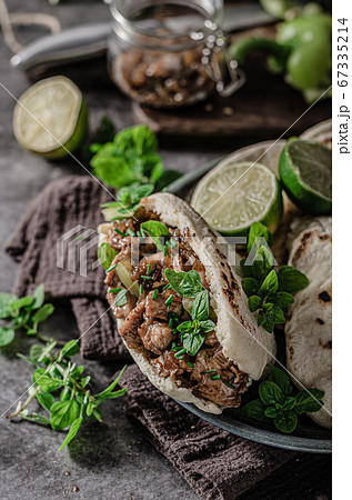 Homemade pita bread with meat and herbs 67335214