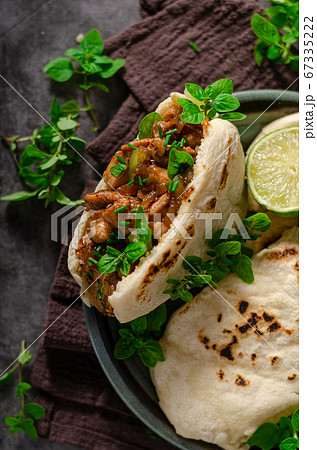 Homemade pita bread with meat and herbs 67335222