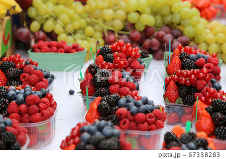 Bright fresh berries and fruits on the market 67338283