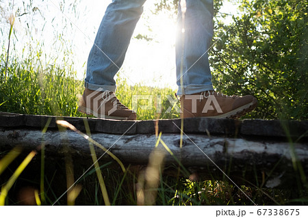 View on hiking boots at small wooden bridge. 67338675