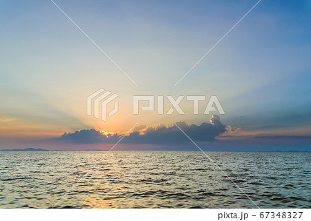 Beautiful dramatic sky clouds with light rays over the sea at sunset time. Natural landscape for background Beautiful dramatic sky clouds with light rays over the sea at sunset time. Natural landscape for background 67348327