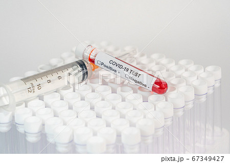 Blood test of COVID-19 and medical syringe on white background Blood test of COVID-19 and medical syringe on white background 67349427