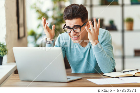 Stressed ethnic freelancer working on remote Stressed ethnic freelancer working on remote 67350571