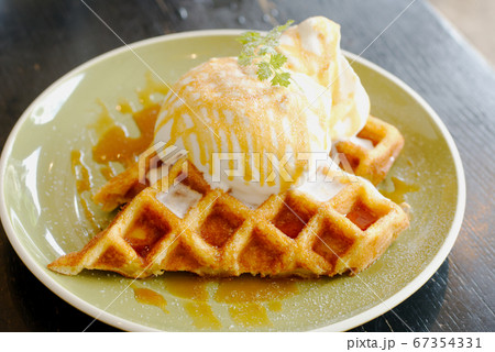 Cafe dessert Caramel Salty Waffle on top with whipping cream 67354331