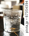 Cold ice water with ice bar in clear glass  67354394