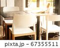 Abstract blurred empty restaurant seat and table background with no people, 67355511