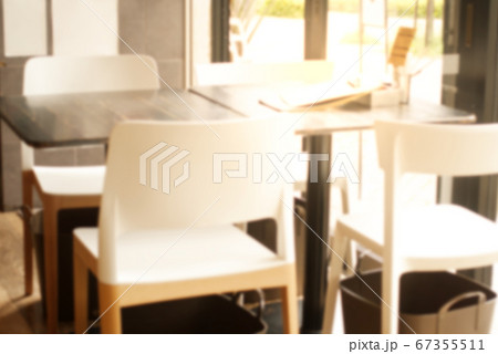 Abstract blurred empty restaurant seat and table background with no people, 67355511