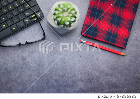 high angle view of eyeglass, notepad and keyboard with copy space  67356835