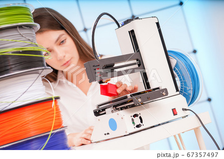 Young female designer working on a prototype 67357497
