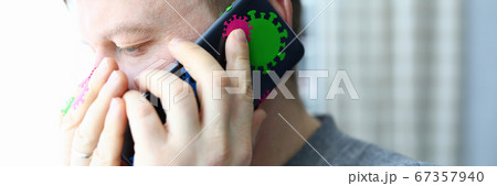 Man speaks on phone infected with coronavirus Man speaks on phone infected with coronavirus 67357940