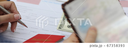Woman fills out visa application form in usa Woman fills out visa application form in usa 67358393