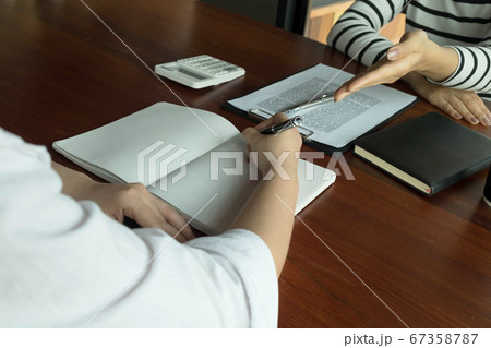 Woman talking with colleague about new startup project.Business people brainstorming concept. Woman talking with colleague about new startup project.Business people brainstorming concept. 67358787