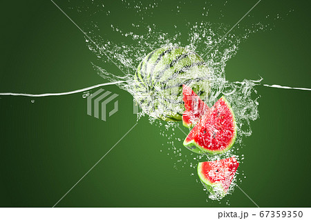 Water splashing on Slice of watermelon underwater 67359350
