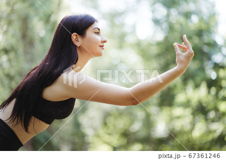 Young woman doing yoga exercises, close up Young woman doing yoga exercises, close up 67361246