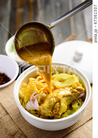 Northern Thai food (Khao Soi),Spicy curry noodles soup with chicken 67361507