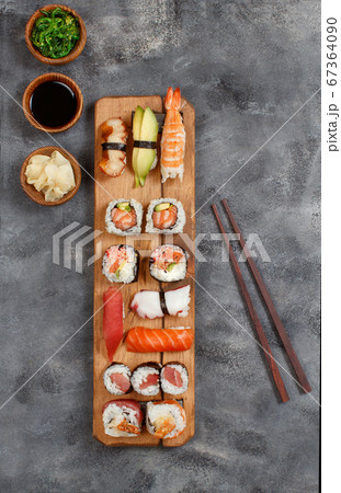 Sushi Set nigiri and sushi rolls on a wooden tray Sushi Set nigiri and sushi rolls on a wooden tray 67364090