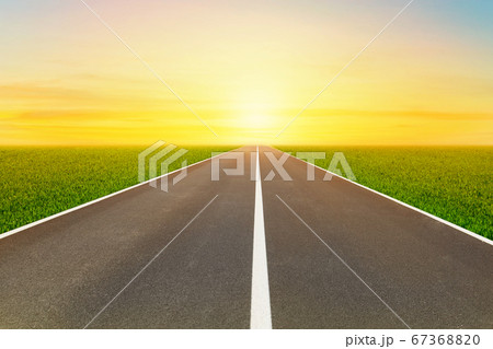 Empty asphalt street road to infinity highway with golden sky in background. Empty asphalt street road to infinity highway with golden sky in background. 67368820