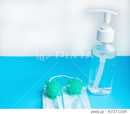 Antiseptic spray and MEDICAL MASK on a BLUE 67371109