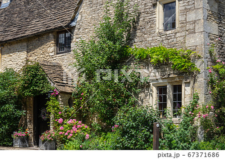 Castle Combe is a village and civil parish within the Cotswolds Area of Natural Beauty in Wiltshire. England, UK, July 11, 2020 Castle Combe is a village and civil parish within the Cotswolds Area of Natural Beauty in Wiltshire. England, UK, July 11, 2020 67371686