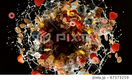 Freeze motion of rotating cereal pieces with milk Freeze motion of rotating cereal pieces with milk 67373259