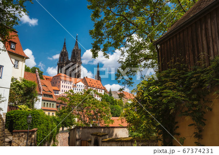 Medieval Meissen old city with beautiful Albrechtsburg Castle on hill. Dresden, Saxony, Germany. Sunny Day in Spring season Medieval Meissen old city with beautiful Albrechtsburg Castle on hill. Dresden, Saxony, Germany. Sunny Day in Spring season 67374231