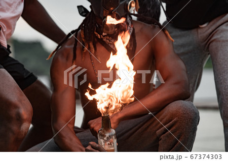 black american demonstrators set fire on bottles with cloth 67374303