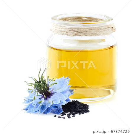 Black cumin oil on white background Black cumin oil on white background 67374729