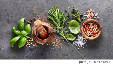 Herbs and spices on black background 67374891